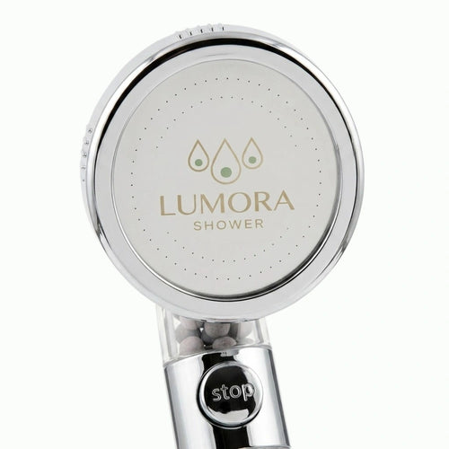 Lumora Shower showerhead face with one-touch stop button